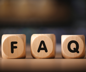 the word faq spelled with wooden blocks on a table