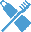 a blue toothbrush and a tube of toothpaste on a green background
