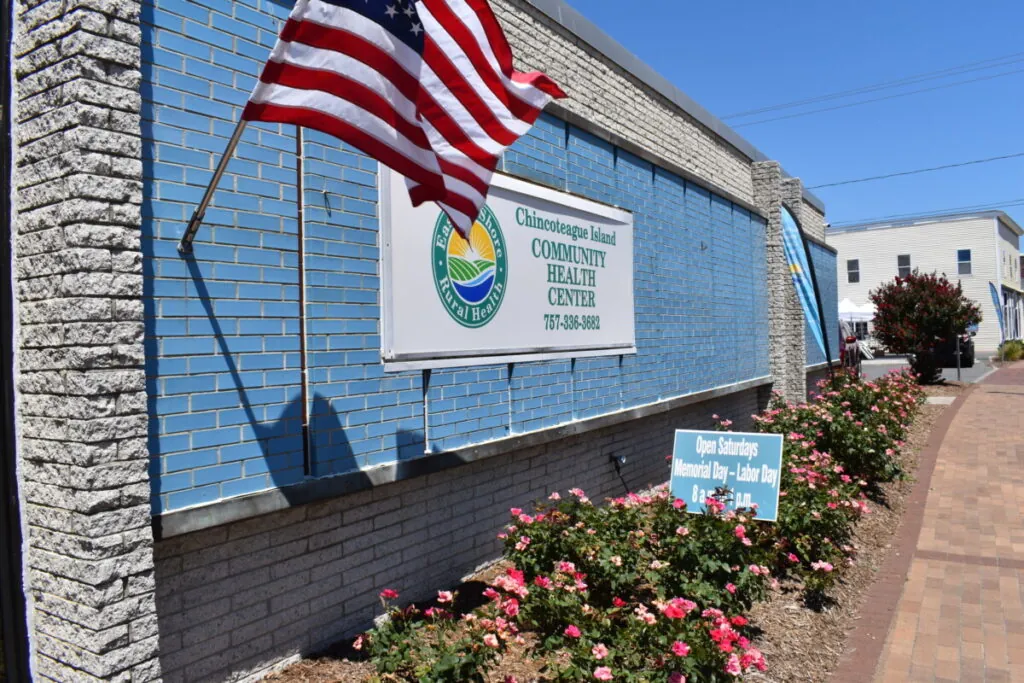 a brick building with an american flag on it