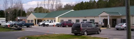 several cars parked in front of a building