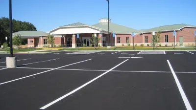an empty parking lot in front of a building