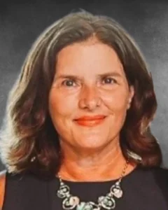 a woman wearing a black dress and a necklace